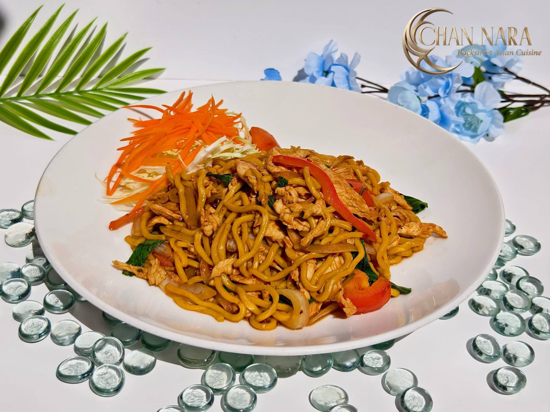 Lo Mein Drunken spicy stir fry with Chinese egg lo mein noodles, Thai basil, onions, and bell peppers