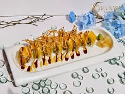 Treasure Island Roll shrimp tempura, spicy crab, cucumber, mango, fried potatoes and eel and mango sauce