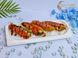 Jalapeno Poppers (4pcs) deep-fried with spicy tuna, cream cheese, spicy mayo, and unagi sauce