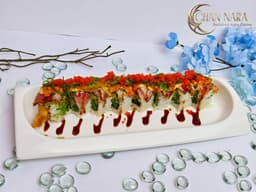 50 West Roll with shrimp tempura, jalapeno, cucumber, seared tuna, seaweed salad, scallion, masago, and spicy mayo