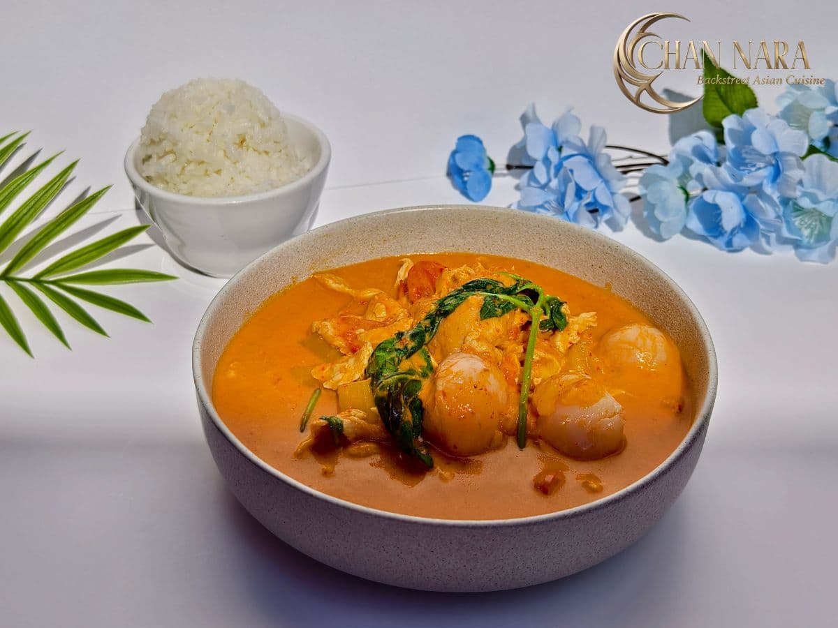 Red Curry with chili peppers, coconut milk, Thai basil, cherry tomatoes, pineapple, and lychee