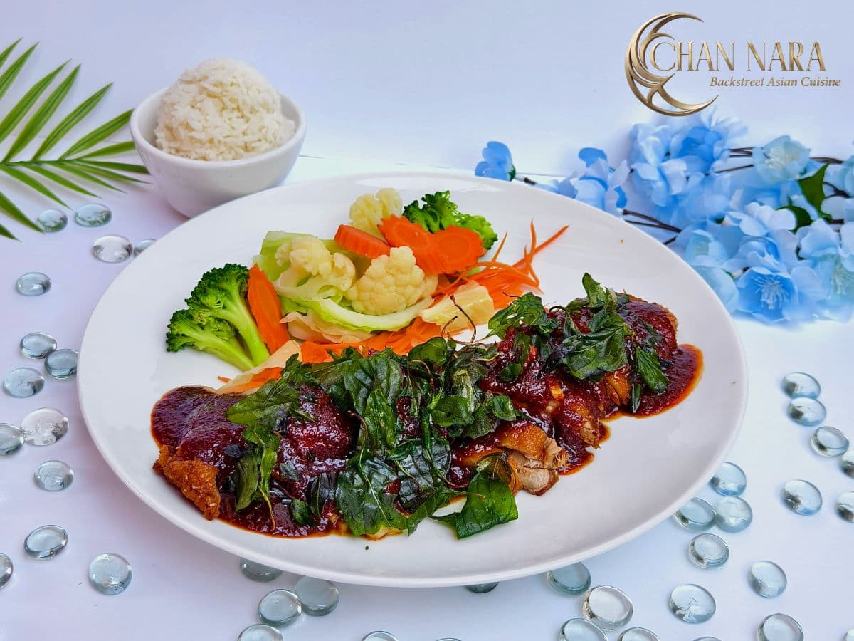 Crispy Duck marinated, steamed, deboned and fried, served with fried Thai basil and sweet dipping sauce