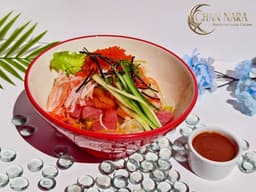 Korean Spicy Chirashi with fresh fish, mixed veggies, rice, and gochujang spicy sauce