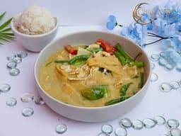 Green Curry with coconut milk, Thai eggplant, Thai basil, green beans, bell pepper, and bamboo shoots