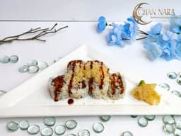 Crunch Shrimp Crab Roll with steamed shrimp, imitation crab, crunch, and eel sauce
