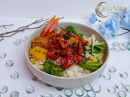 Tuna Poke Bowl with giant cuts of tuna, poke sauce, rice, masago, cucumber, seaweed salads, red radish, and avocado